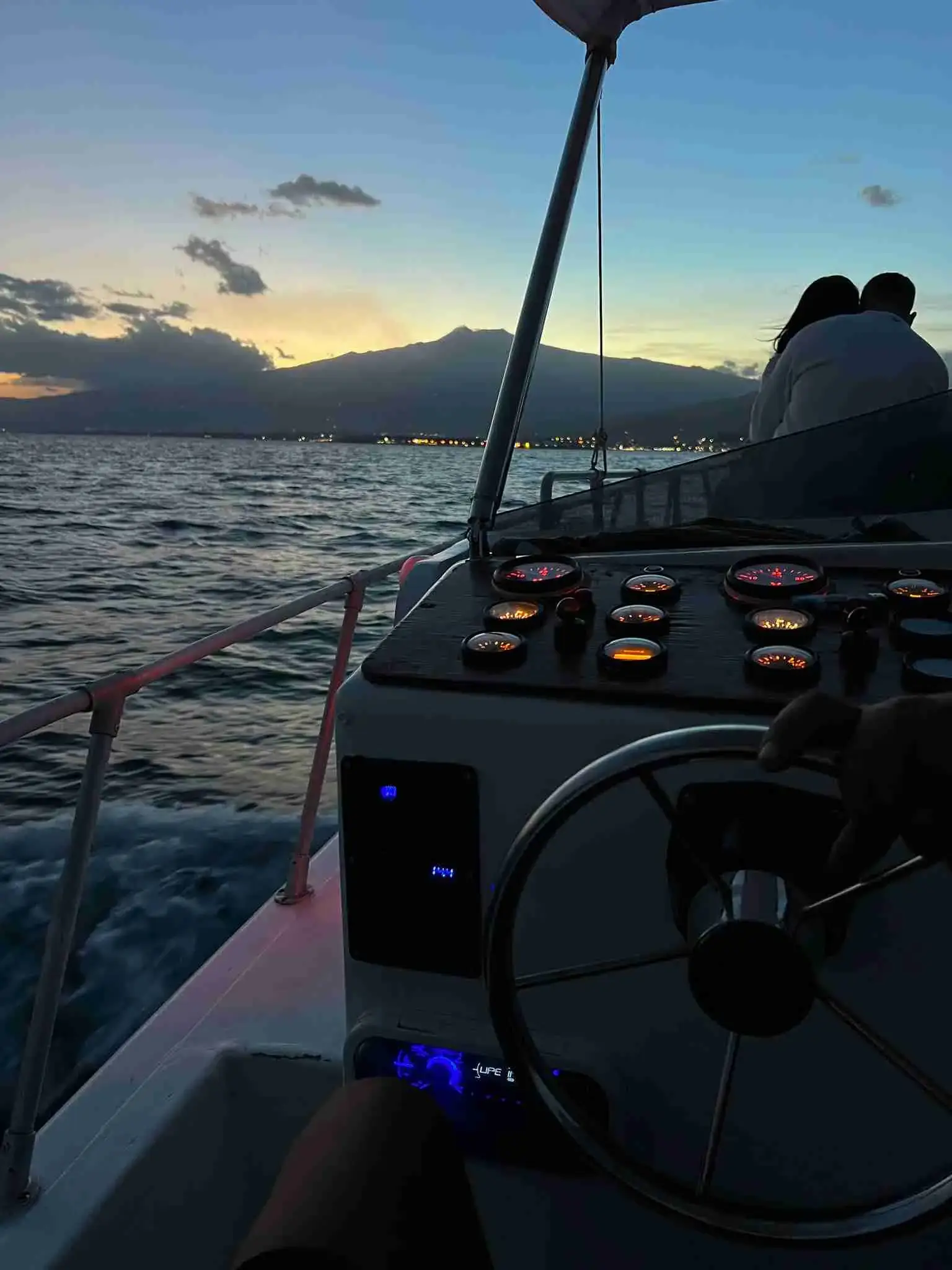 The captain’s helm at dusk on the way back to port