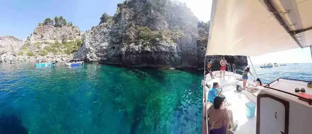 Crystal-clear turquoise water at Isola Bella, seen from the boat